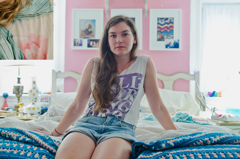 Abby (Hannah Gross) sitting on bed